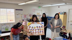 U.S. Rep. Adelita Grijalva, center, receives an art project from students at the WACOG Carlisle Head Start Program in Somerton on Tuesday, Oct. 27, 2026. At right is WACOG Executive Director Veronica Shorr.
