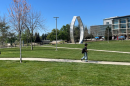A student walks in front of the "Beginnings Sculpture" on the UC Merced campus on Thursday, March 26, 2026.
