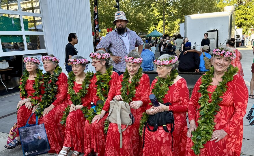 A group of dancers with Halau Hula o Na Pau o Hawaii Nei wait their turn on stage.