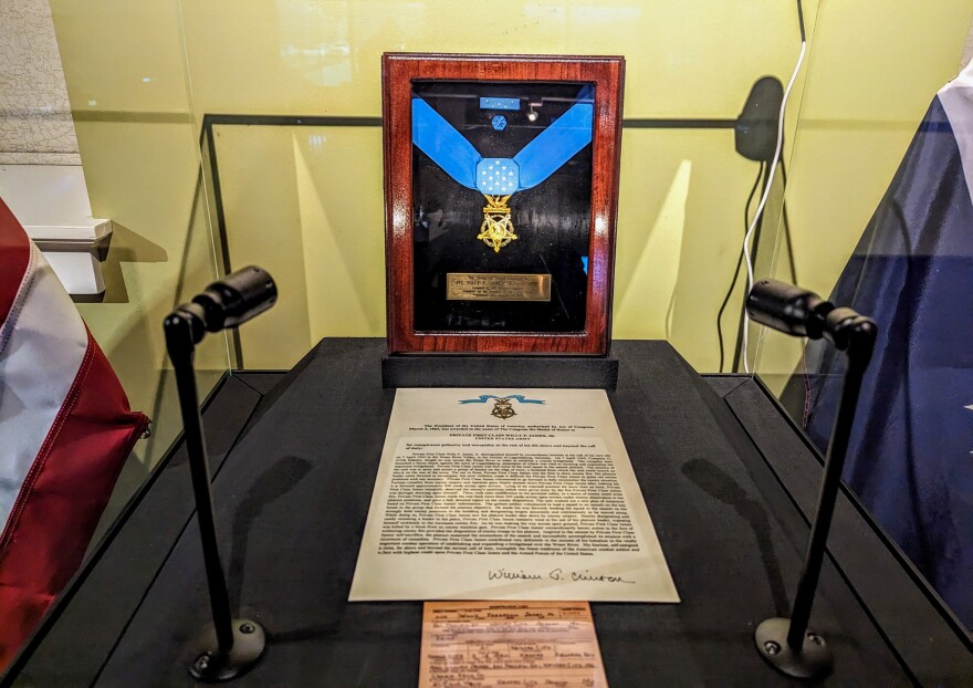 The display case housing Pfc. Willy F. James Jr. Medal of Honor, the Letter of Recognition and his original World War II draft card. The exhibit is housed at the Black Archives of Mid-America in Kansas City in the 18th & Vine District.