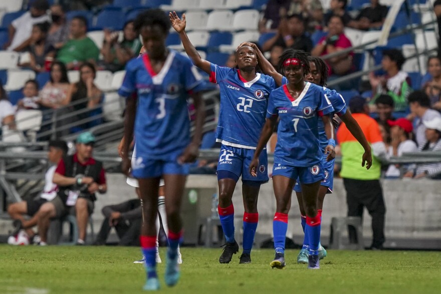 Haiti's Roselord Borgella (22) celebrates scoring from the penalty spot her side's opening goal against Mexico during a CONCACAF Women's Championship soccer match in Monterrey, Mexico, Thursday, July 7, 2022.