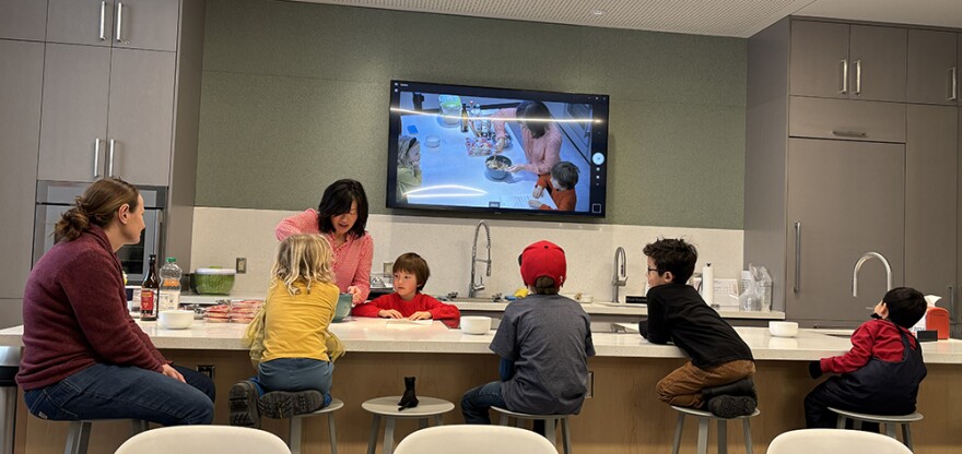 Cash Quinn and his mom, Emmy Quinn, teach how to make Chinese New Year dumplings for Family Kitchen Lab. He started the class with talking about family traditions for ringing in a lucky year.