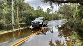Water on the only road in and out of this central Florida neighborhood on Lake Harney left residents stranded after Hurricane Ian. Photo by Amy Green 