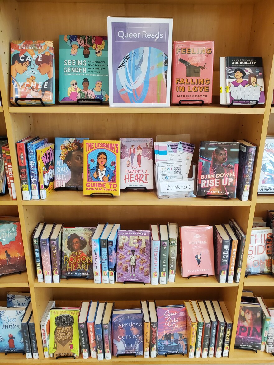 A shelf with "Queer Reads" at the Wake County Library Oberlin Road branch.