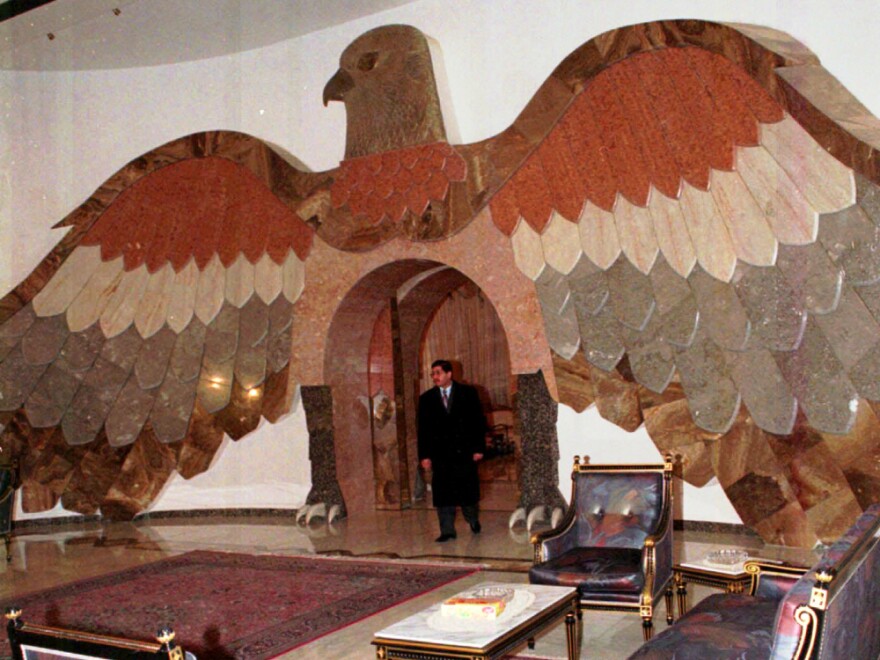 Taken during a 1997 tour of one of Saddam Hussein's palaces, this photo shows a giant falcon made from Italian marble.