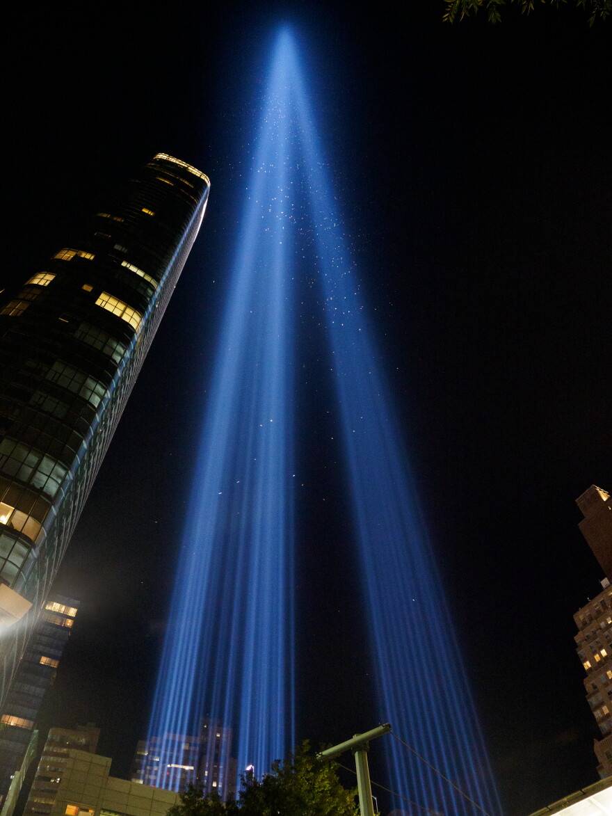 The Tribute in Light rises over Lower Manhattan on the 25th anniversary of 9/11. As night fell, the crowds thinned and the sounds of the day faded beneath the beams.