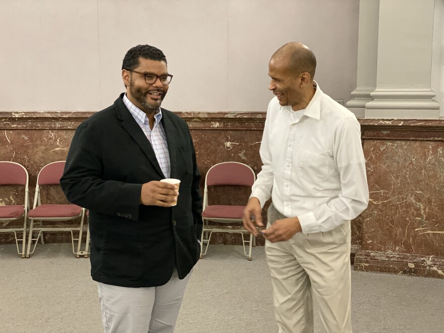 Former Alderman Antonio French converses with Board of Aldermen Clerk Terry Kennedy on Nov. 21, 2019.