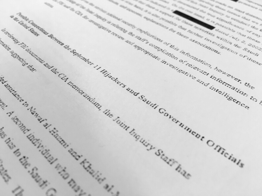 A section of one of the 28 pages from the once-top secret congressional report into 9/11 that questioned whether Saudis who were in contact with the hijackers after they arrived in the U.S. knew what they were planning. Parts of it are still redacted.