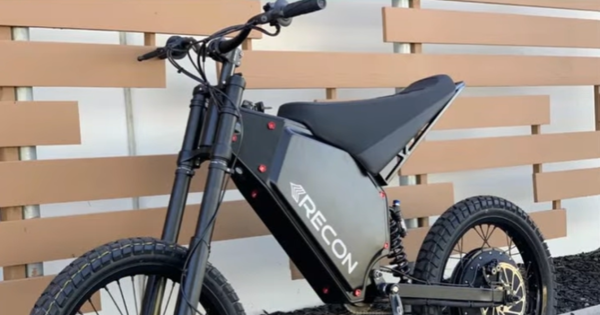 A screenshot from the City of Eugene's Facebook page shows an e-moto against a curb. E-motos are distinguished from e-bikes through their lack of pedals and speeds exceeding 15 miles per hour.