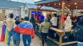 Families draped themselves in Venezuelan flags and colors on Saturday afternoon at The Latin Corner on Jan. 3, a Venezuelan bar and food truck spot in Pineville, a suburb of Charlotte.