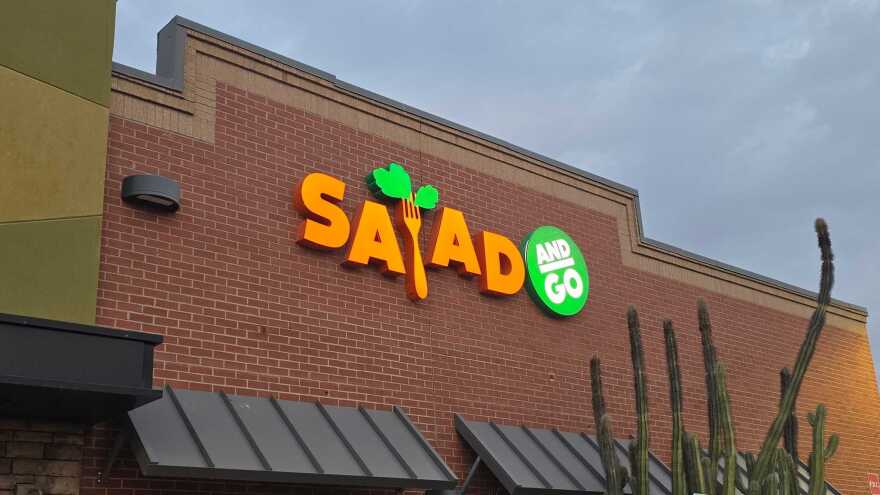 brick building with  A Salad and Go lighted sign