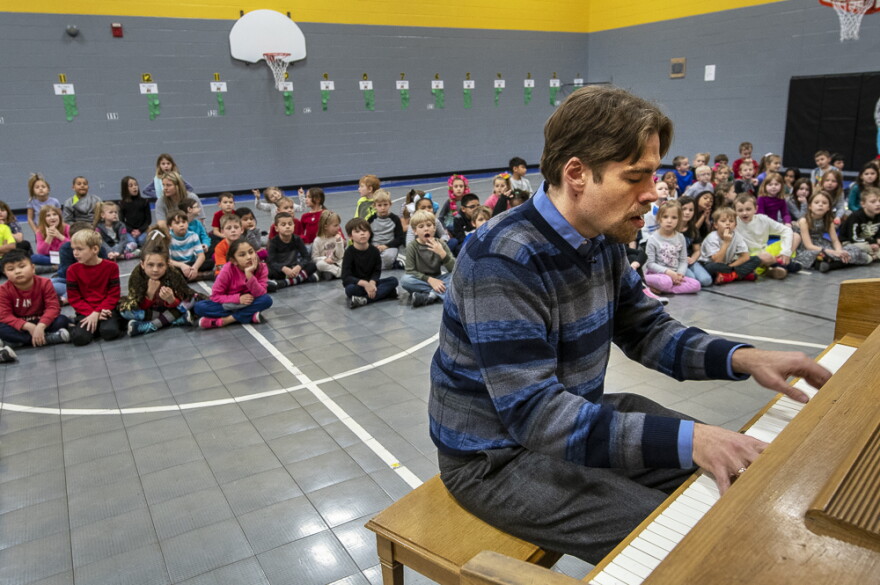 Pianist William McNally plays the 'Maple Leaf Rag' for students at Skyline Elementary School in Sedalia, Mo.