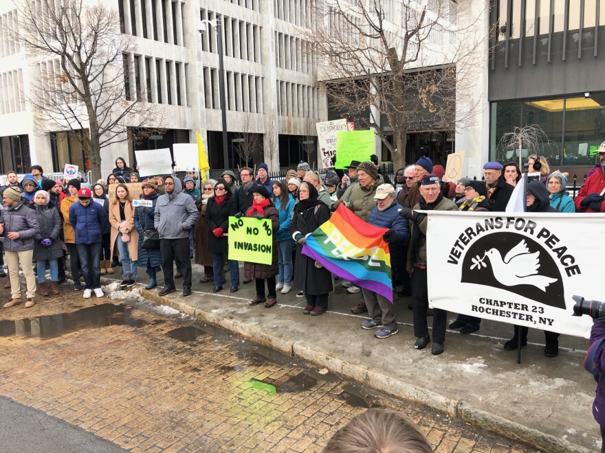 Protesters gather outside the federal building in Rochester on Thursday afternoon.
