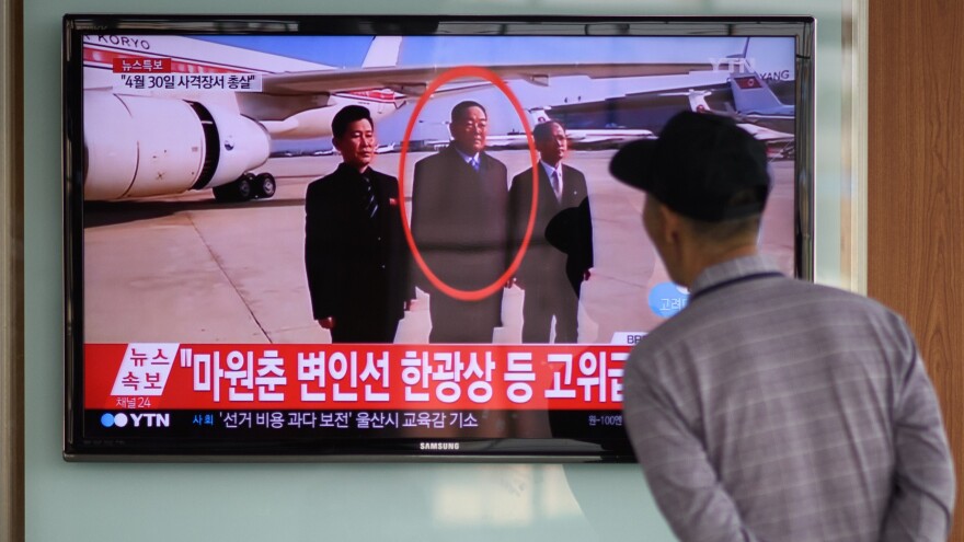 A man watches a television showing news coverage of the reported execution of North Korea's defense minister, Hyon Yong Chol, at a railway station in Seoul on Wednesday.