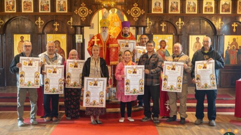 Individuals and representatives of organizations that supported the glorification of St. Olga pose with certificates of merit from the Orthodox Diocese of Sitka and Alaska at the St. Sophia Russian Orthodox Church in Bethel on