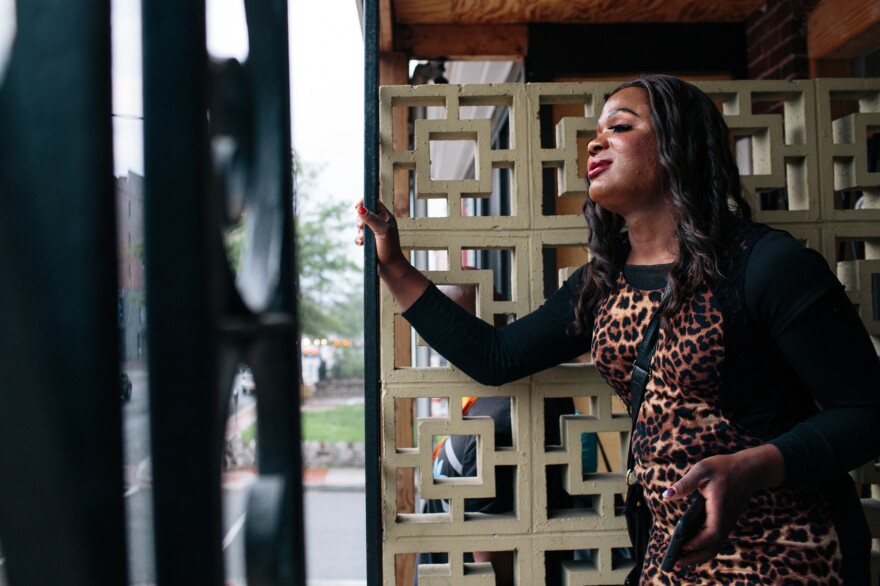KayLynn Jones, 32, an intern at Casa Ruby, stands on the porch while waiting for the rain to stop. Jones started working at the drop-in and service center for transgender people in Washington, D.C., in order to be more active in the transgender community doing outreach.