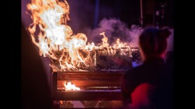 an upright piano on fire