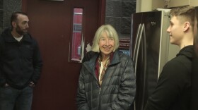 Victoria Lydle speaks with public safety officials who rescued her after she was mauled by a bear in July. Lydle met with over a dozen responders at Fire Station 14 in East Anchorage on Nov. 25.