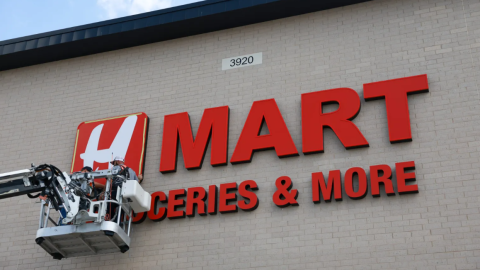 Workers put up the H Mart letters Sept. 18 in Haltom City.