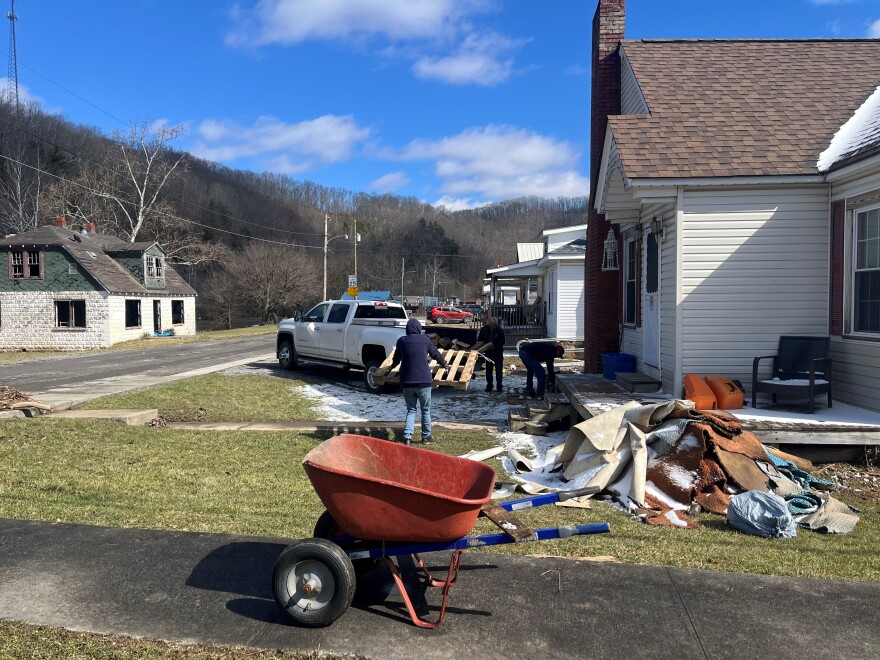Maudy Jones and her husband Dwight are pulling out soaked furniture, carpet and clothes from their home in Richlands.