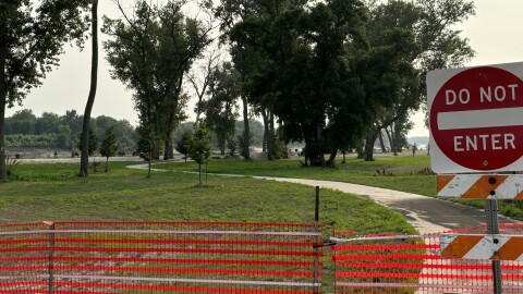 A closed section of the Sioux City Riverfront Trail is shown on July 23, 2024, where sand from the Missouri River has covered up the trail. Other sections north to Riverside Park three miles to the north are completely damaged. (Photo by Bret Hayworth, Siouxland Public Media)