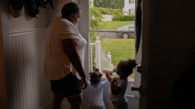 Vicki Lightfoot stands by the front door with Maurice and Marie while waiting for the other grandkids, Alysha and Corey, to finish getting ready for school.
