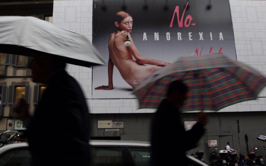 A Pedestrian walks past a Nolita advertisement during Spring/Summer fashion week on Sept. 26, 2007 in Milan, Italy. Isabelle Caro, 27, was photographed for Flash & Partners' Italian clothing company's label Nolita. The company said they are running a campaign to raise the issue of the fashion industry's responsibility for anorexia.