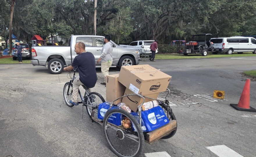 A evening food distribution in Immokalee recently let those who might not be able to attend a daytime event get access to needed food staples and supplies.
