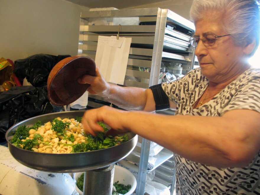 Leila Sfeir mixes her Lebanese-style falafel, which includes lots of green herbs.