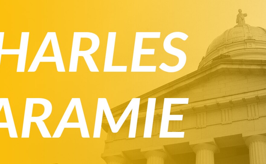 An illustration of the Vermont Statehouse with the name Charles Laramie