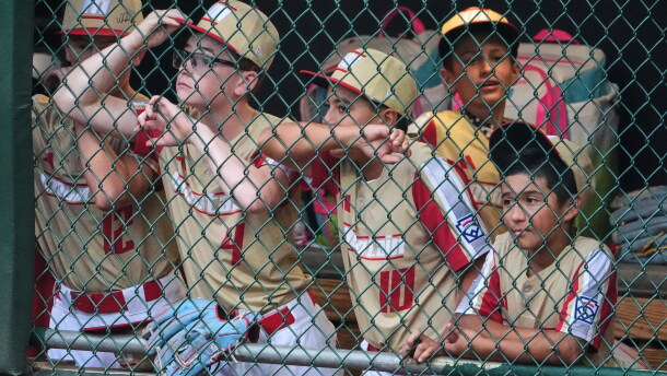 Members of the Little League team from Henderson, Nev., stand in their dugout during the sixth inning of the Little League World Series Championship baseball game against Curacao in South Williamsport, Pa., Sunday, Aug. 30, 2026. (AP Photo/Gene J. Puskar)