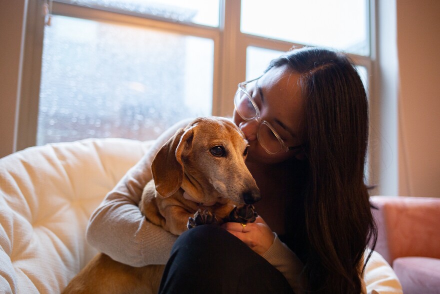 Stephanie Drenka kisses her dog Daisy.