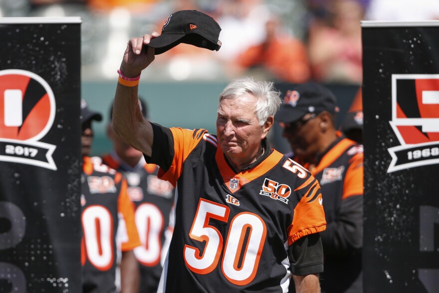 Former Cincinnati Bengals quarterback John Stofa waves to the crowd during a halftime 50th anniversary ceremony of an NFL football game against the Baltimore Ravens, Sunday, Sept. 10, 2017, in Cincinnati.