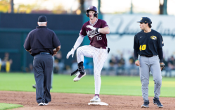 Caden Bogenphl reaches second base and celebrates during Mizzou rivalry game