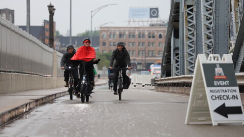 Bikers make their way up the incline of the Veterans Memorial Bridge on a rainy Friday morning. They're making the trek as part of Bike to Work Day, an annual event that encourages biking as an option for commuting to work.