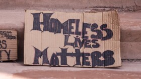 A protest sign at Albuquerque's Civic Plaza near the site of the press conference that reads "Homeless Lives Matter"