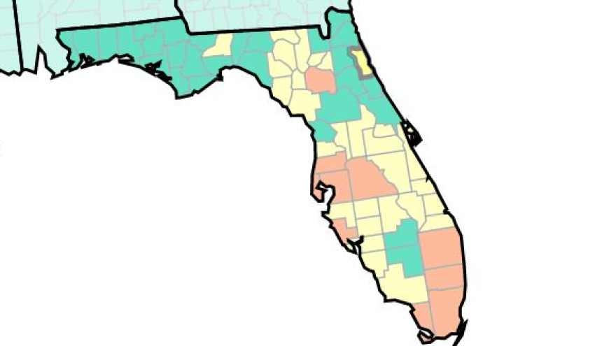 Green counties are considered low risk. Yellow is medium risk, and orange is high.