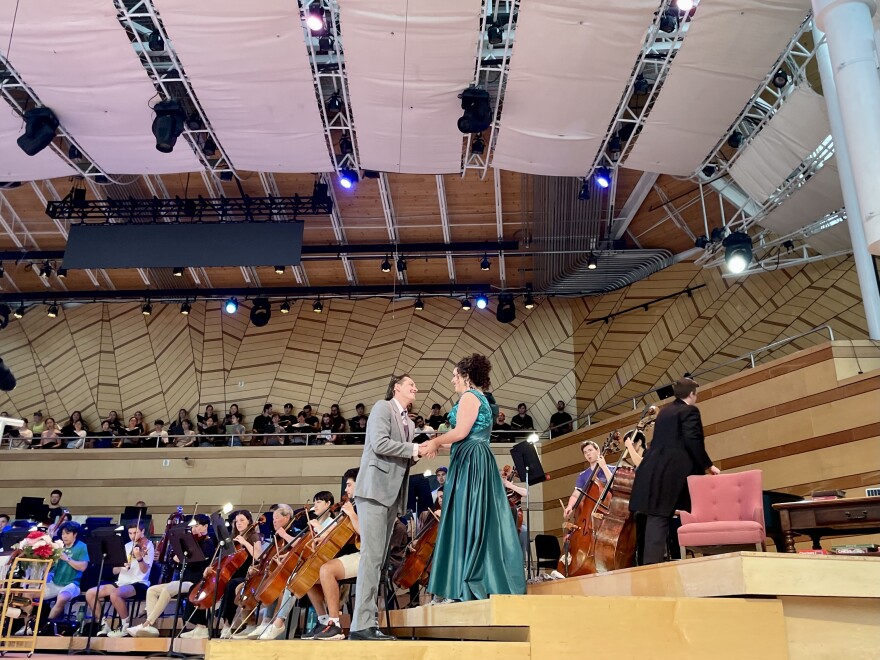 Opera singers perform in a rehearsal of “Bel Canto” at the Aspen Music Festival and School’s Benedict Music Tent. One of the opera’s characters, a fictional soprano named Roxanne Coss, is loosely inspired by Renée Fleming, who helps run the music festival’s opera program.