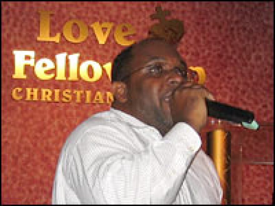 Pastor Sylvester Robinson, seen preaching at his Love Fellowship Christian Church, also leads Jobs Partnership of Florida training sessions. 