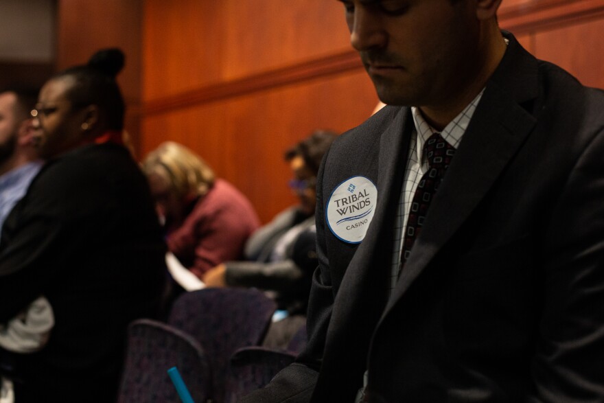 A supporter of the effort to build Connecticut's third casino in East Windsor wears a sticker bearing the project's name at a Public Safety and Security Committee hearing on February 26 in Hartford.