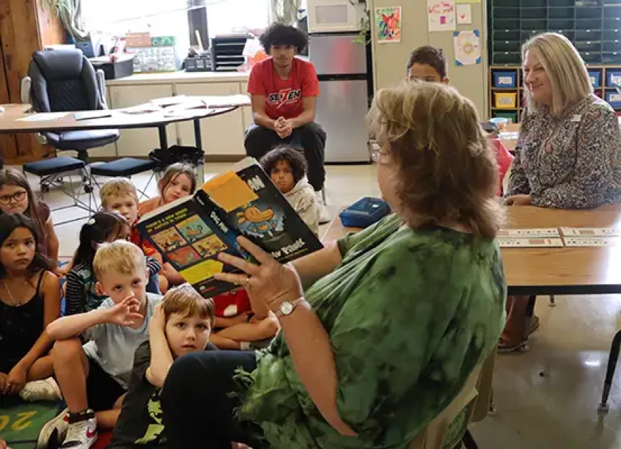 Springfield Public School students listen to the reading of a book.