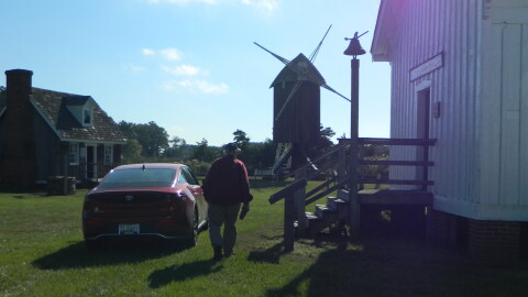 George Radcliffe walks toward the windmill on the Spocott property.