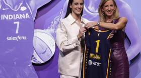 owa's Caitlin Clark, left, poses for a photo with WNBA commissioner Cathy Engelbert, right, after being selected first overall by the Indiana Fever during the first round of the WNBA basketball draft, Monday, April 15, 2024, in New York. (Adam Hunger/AP)