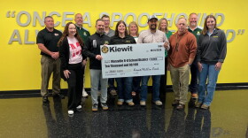 Maryville school district and Kiewit Corporation employees gather for a check presentation at Maryville High School October 1, 2026. Holding the check are (L-R) Maryville school district superintendent Philip Pohren and Heather Bowen and Ryan Mondragon of Kiewit Corporation.