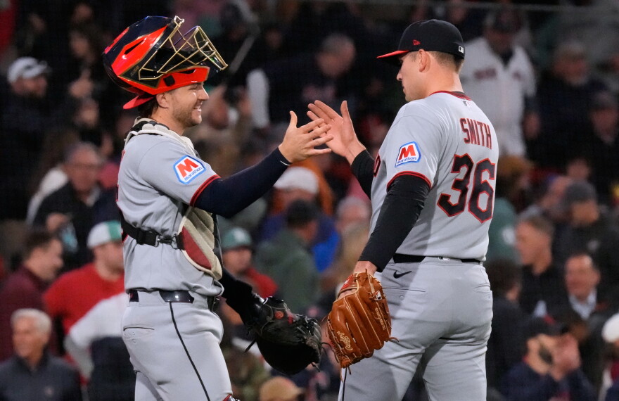 Cleveland Guardians' Cade Smith (36) is congratulated by Patrick Bailey after clinching a post season playoff spot following a baseball game against the Boston Red Sox, Thursday, Sept. 24, 2026, in Boston. 