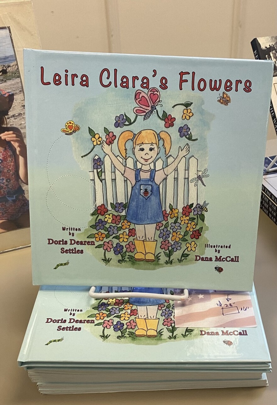 Doris Settles displayed her books including Leira Clara's Flowers during her talk at the library.