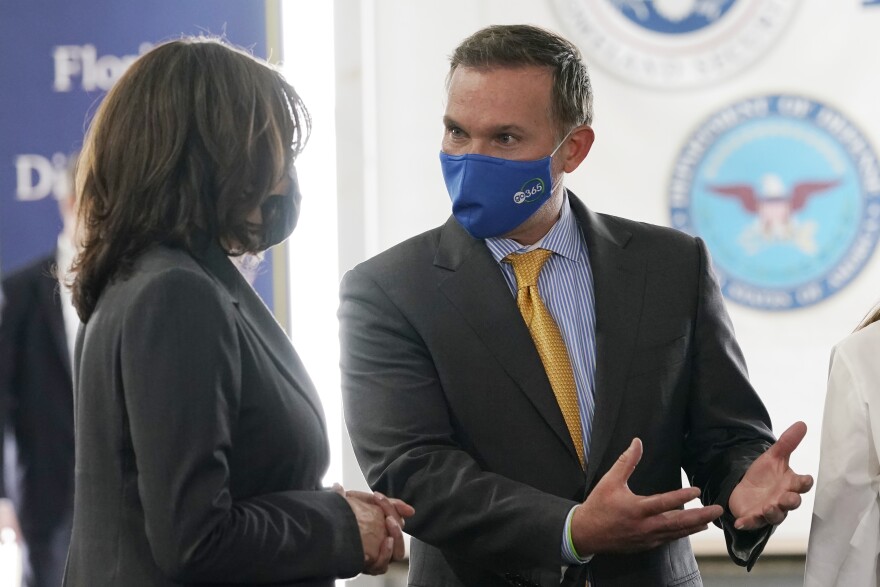 Vice President Kamala Harris talks with Jacksonville Mayor Lenny Curry, as she visits the Jacksonville Community Vaccination Center, in Jacksonville, Fla., Monday, March 22, 2021. (AP Photo/Jacquelyn Martin)