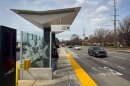 A rider awaits the arrival of the UVX at a station in Provo, Utah, March 14, 2024