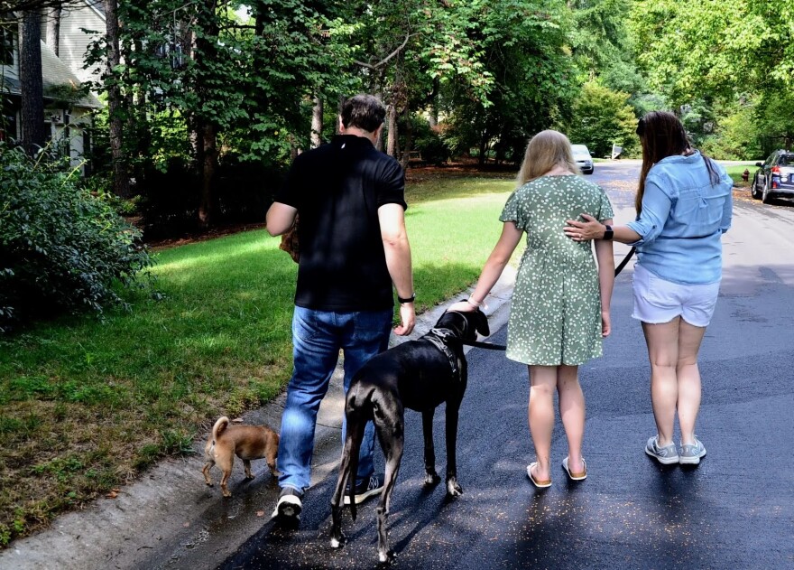 Marie and her parents take their dogs on a walk through their neighborhood in Durham after sharing about their experience with Brynn Marr Hospital.