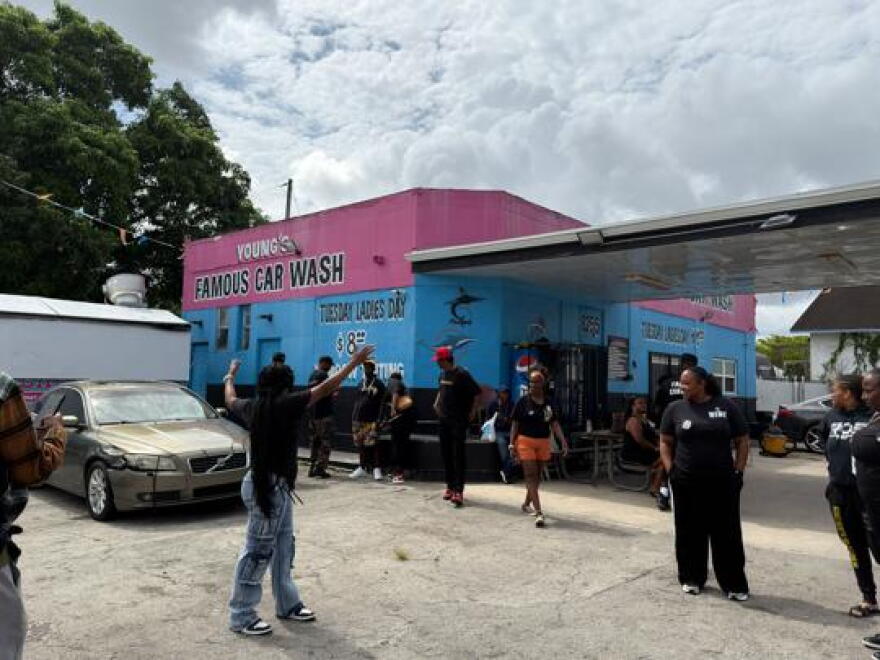 Members of The Black Collective organization gather outside Famous Car Wash to support calls for accountability over a construction project. They are planning a rally and demonstration on Thursday, Oct. 22, 2026, to call attention to the heavy financial strain on local business caused by prolonged roadwork along Northwest 22nd Avenue in Miami.